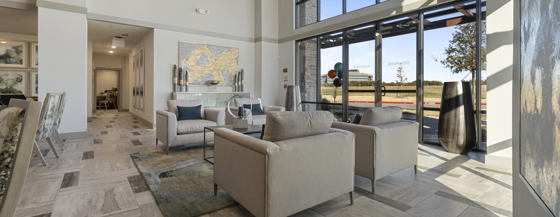 a large lounge room with a large glass wall