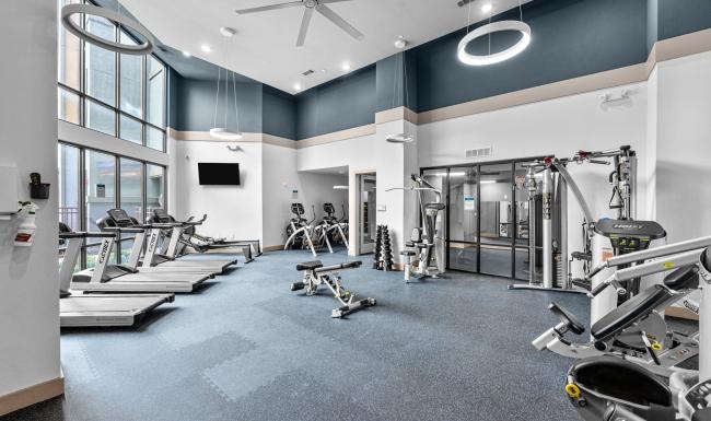 a room with treadmills and treadmills